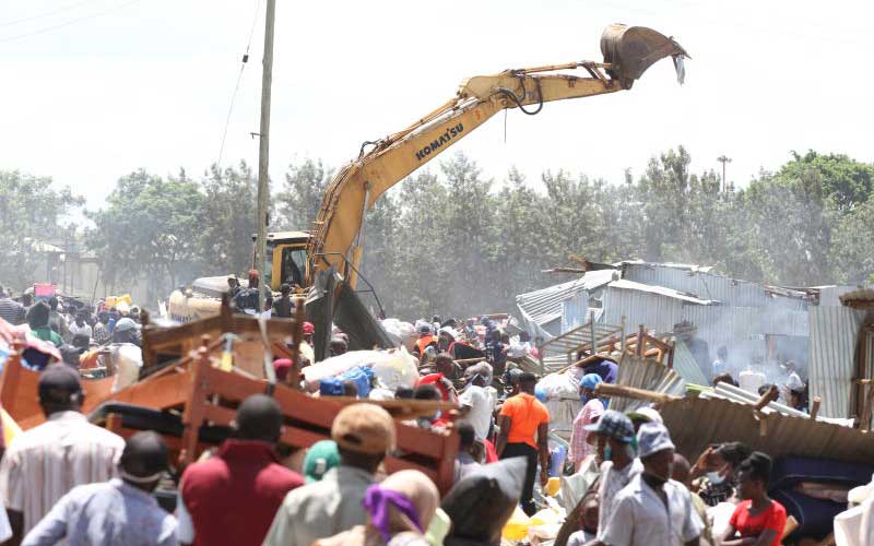 An excavator tears into houses in Kajiji, Sewage area of Kariobangi North, May 4, 2020. Photo: Elvis Ogina www.standardmedia.co.ke